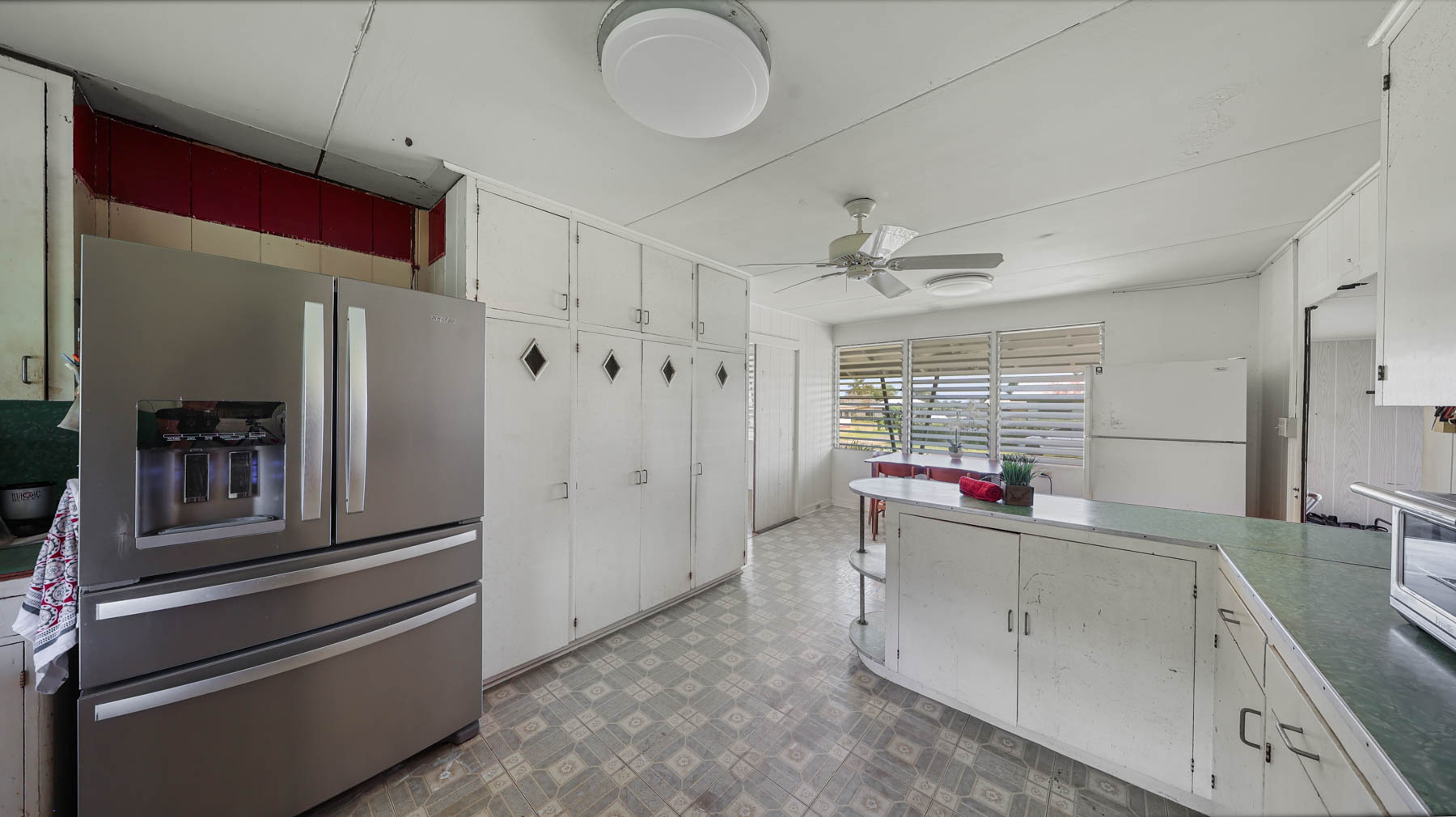 267 Hookipa Road Kapaa, HI 96746 - Photo 16 of 23 a view of a kitchen with a sink and dishwasher