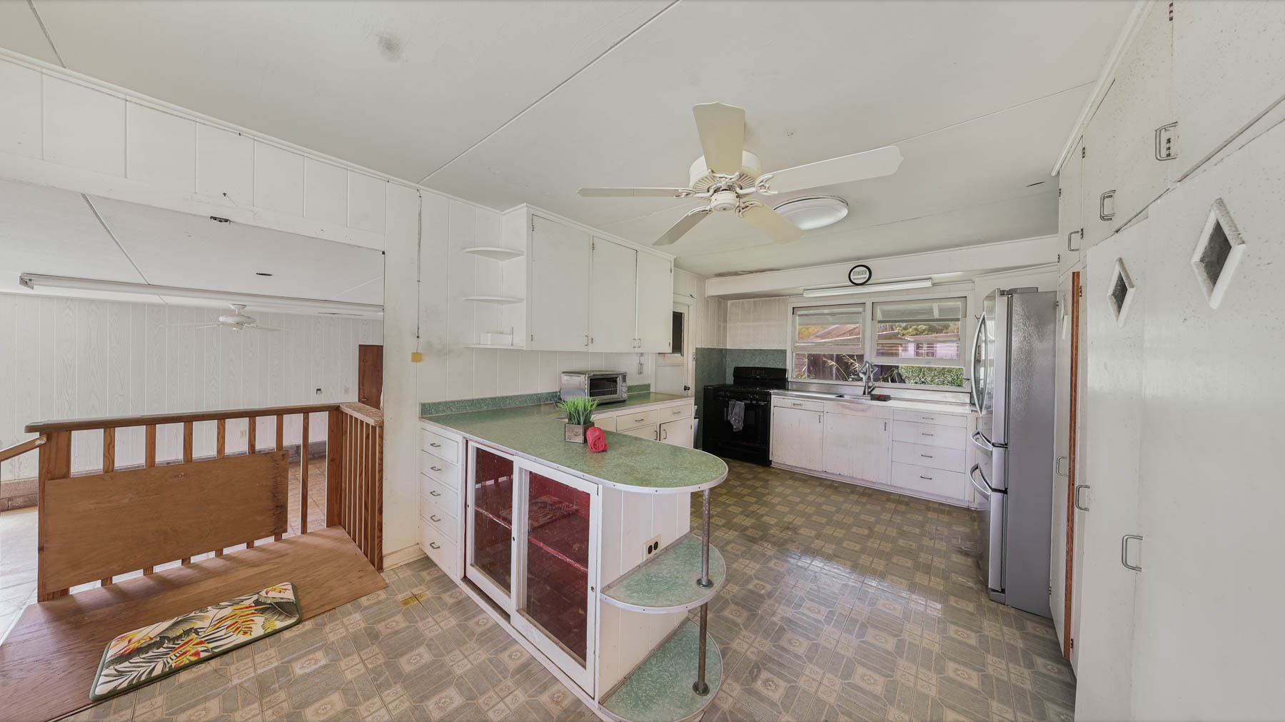 267 Hookipa Road Kapaa, HI 96746 - Photo 22 of 23 a open kitchen with white cabinets and stainless steel appliances