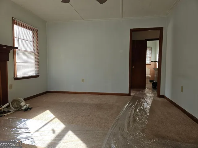 a view of a room that has a bed in it