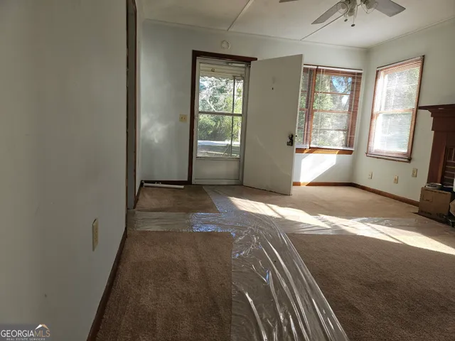 a view of hallway with windows