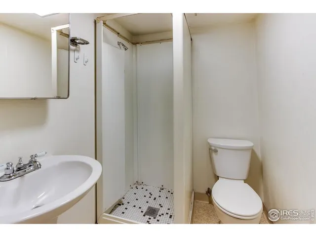 a bathroom with a toilet and a sink