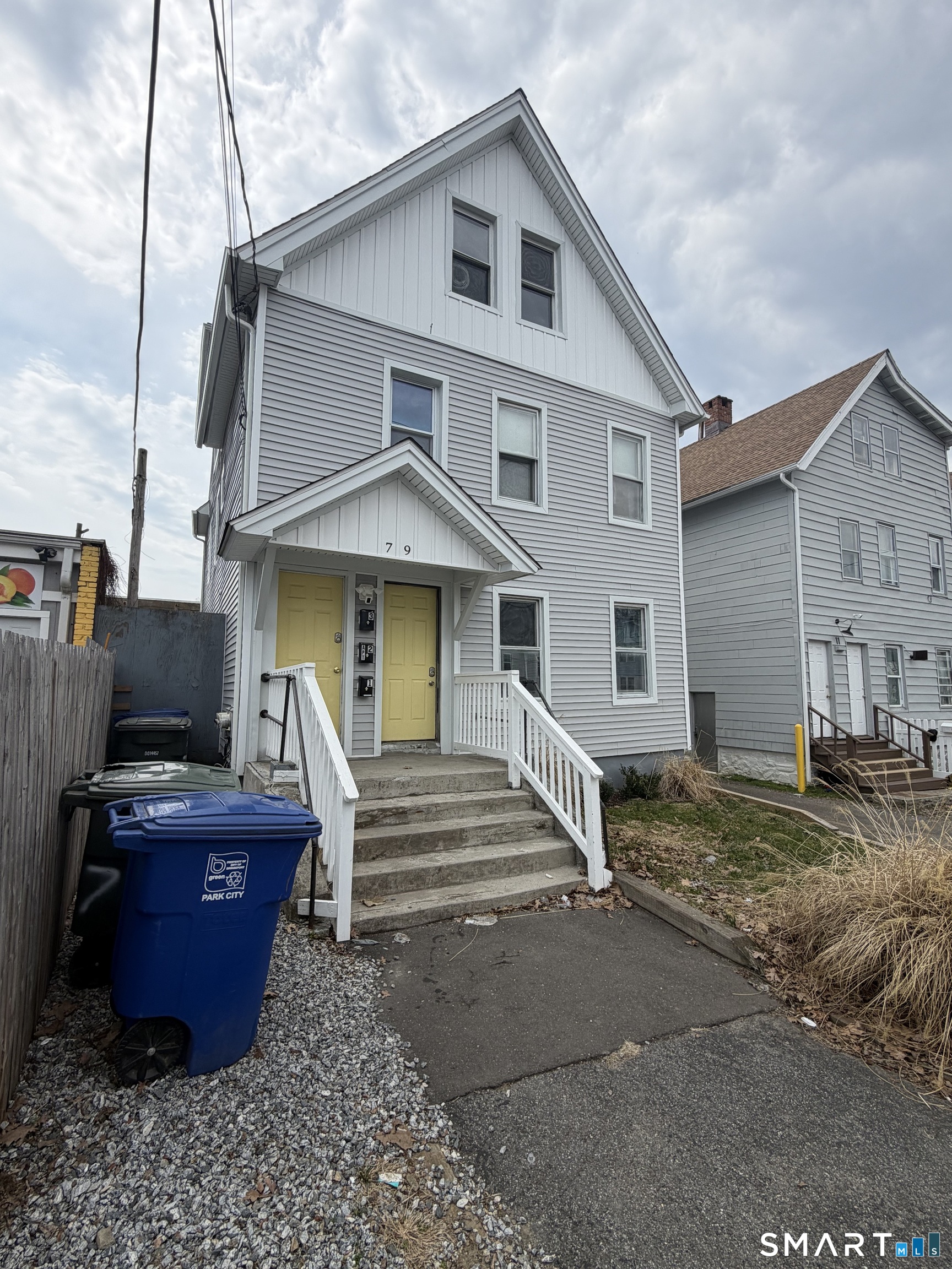 7-9 Wilson Street, Unit 3 Bridgeport, CT 06605 - Photo 1 of 14 a front view of a house with garden