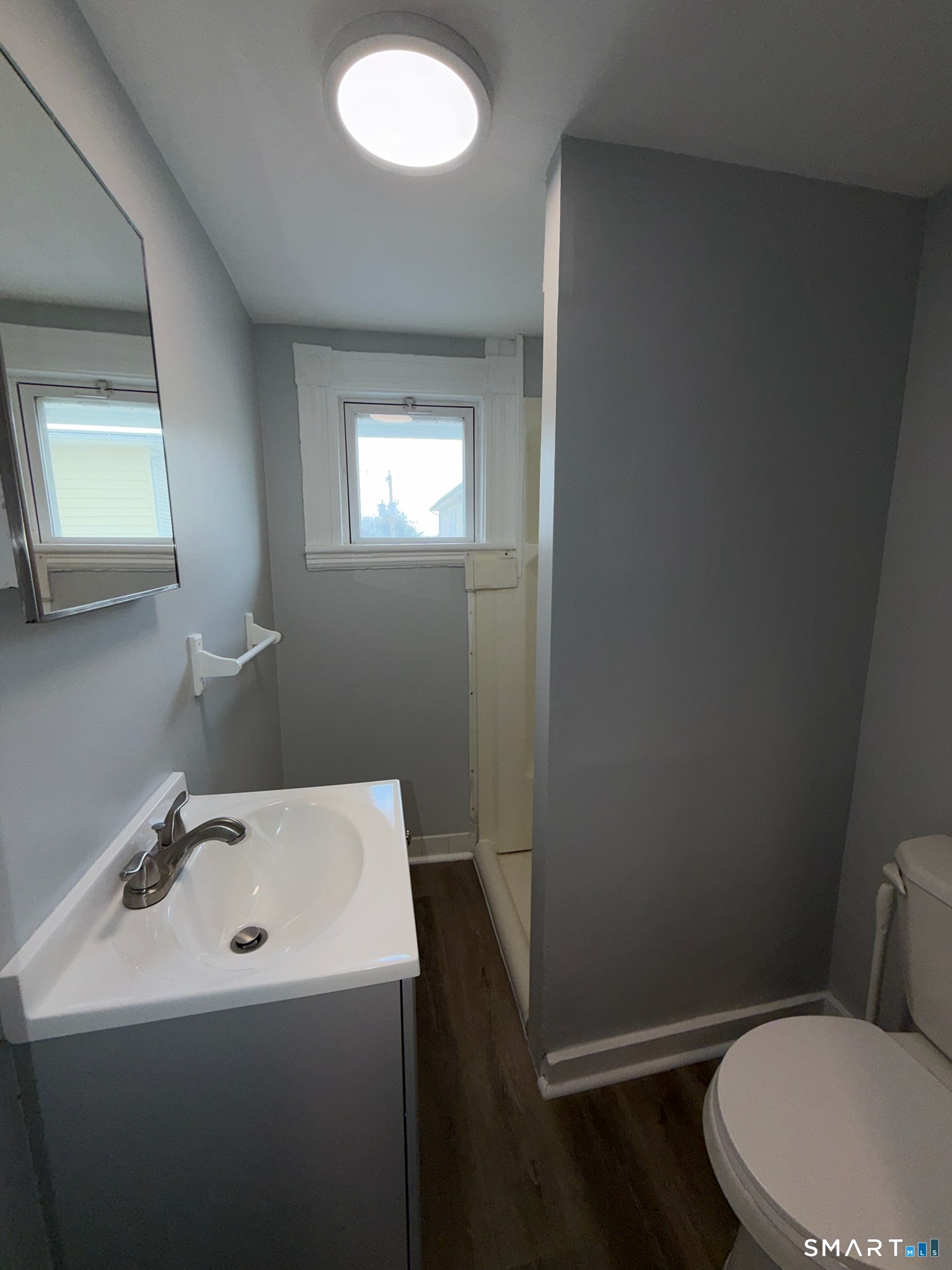 7-9 Wilson Street, Unit 3 Bridgeport, CT 06605 - Photo 11 of 14 a bathroom with a sink a toilet and mirror