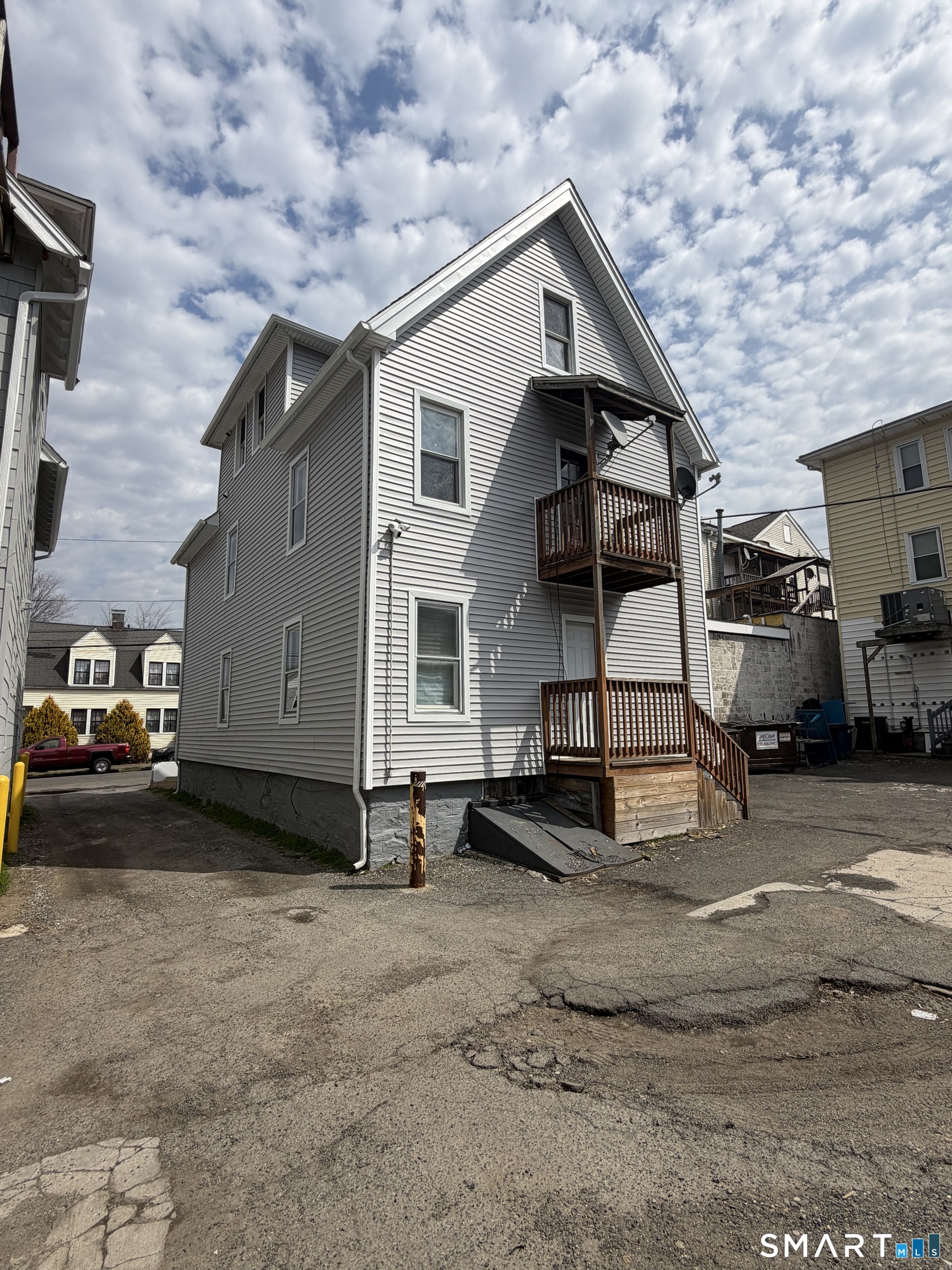 7-9 Wilson Street, Unit 3 Bridgeport, CT 06605 - Photo 2 of 14 a view of a car park in front of house