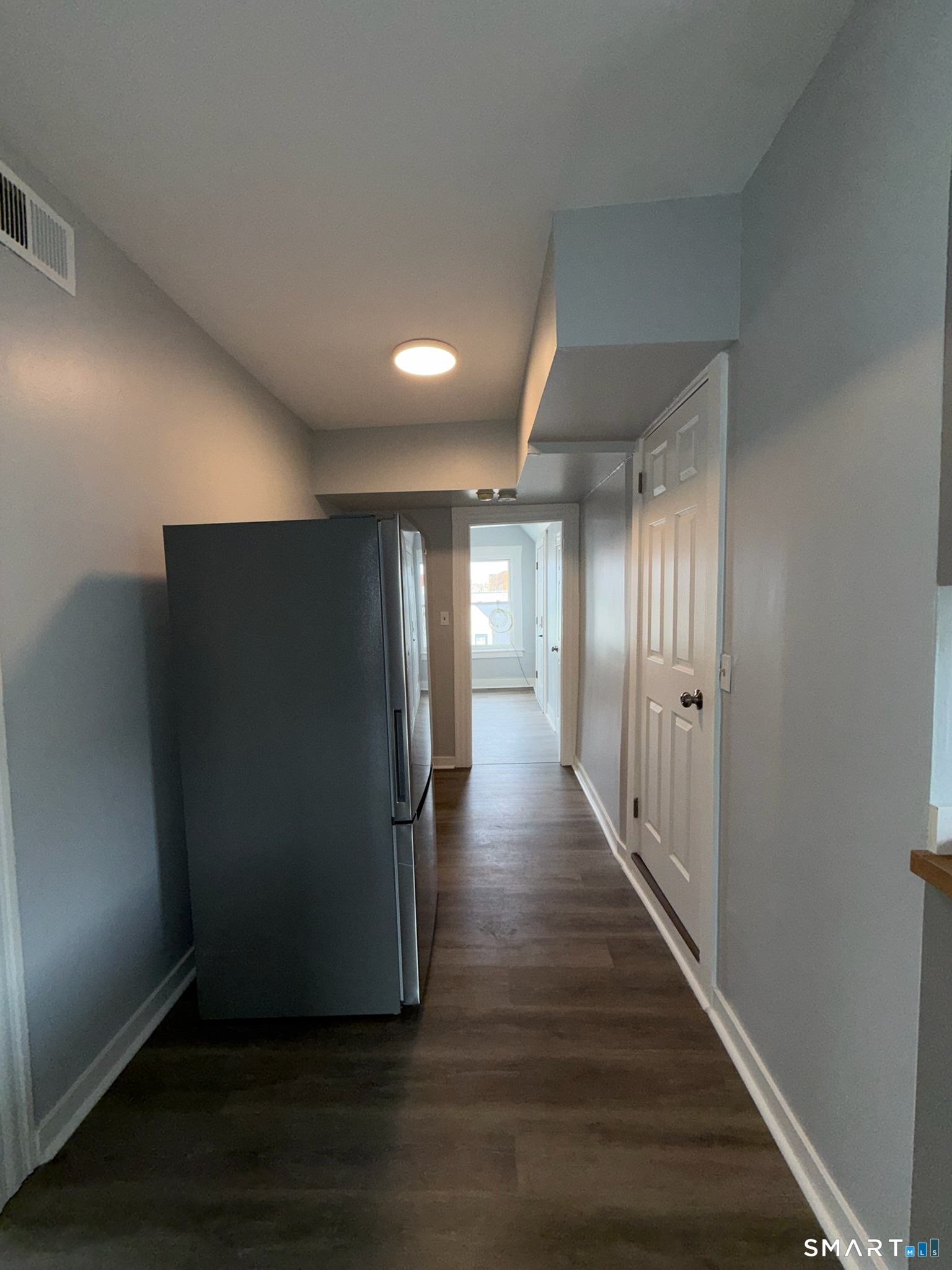 7-9 Wilson Street, Unit 3 Bridgeport, CT 06605 - Photo 5 of 14 a view of hallway with wooden floor