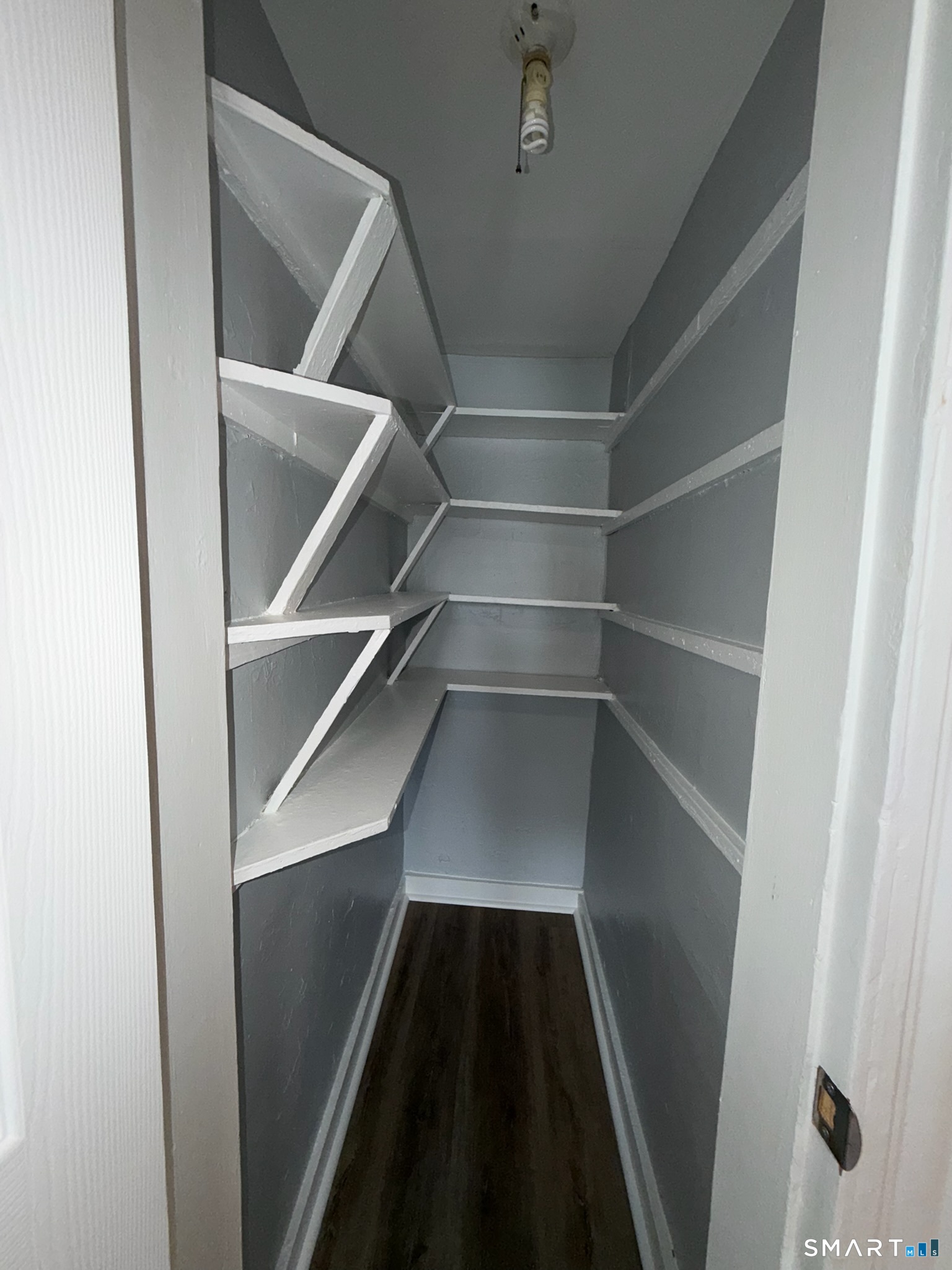 7-9 Wilson Street, Unit 3 Bridgeport, CT 06605 - Photo 10 of 14 a view of walk in closet with empty racks