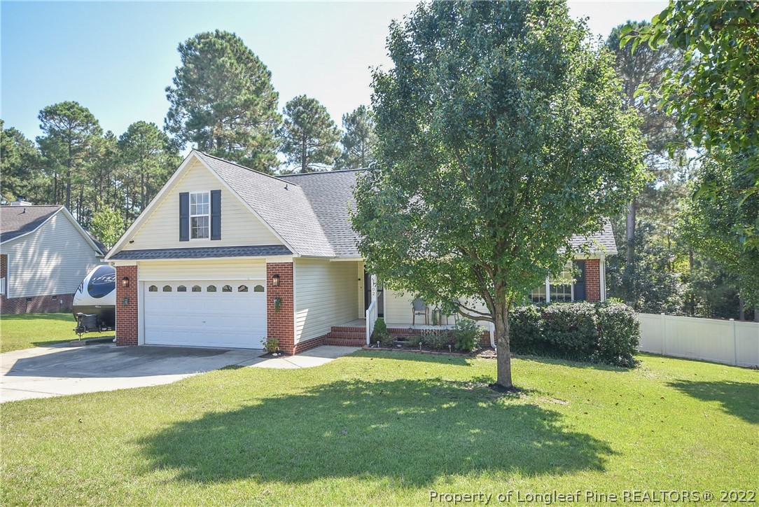 102 Chesapeake Road Cameron, NC 28326 - Photo 1 of 50 a front view of a house with garden