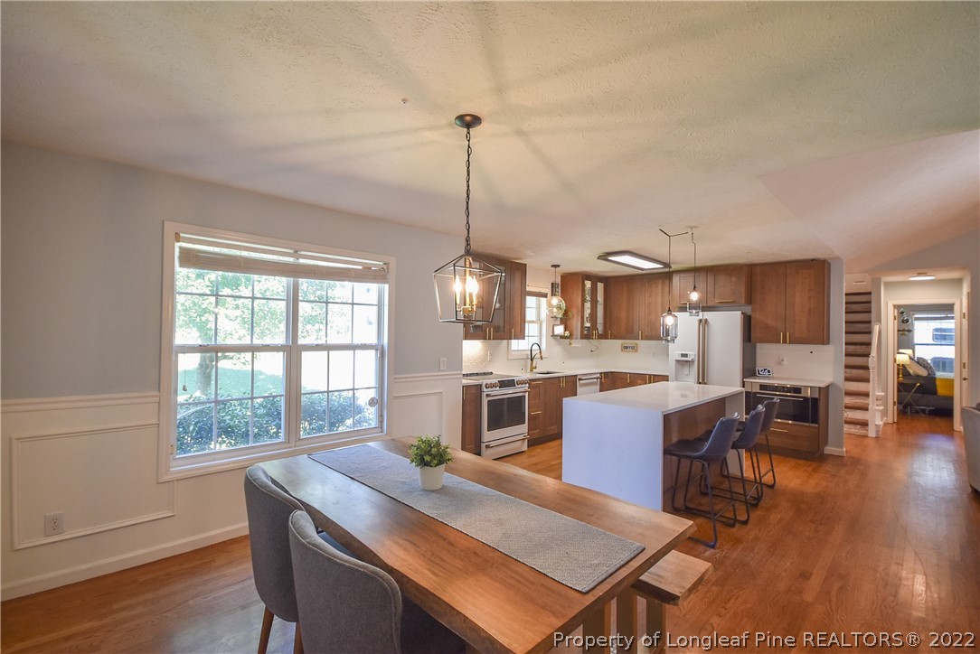 102 Chesapeake Road Cameron, NC 28326 - Photo 14 of 50 a view of a dining room with furniture window and wooden floor