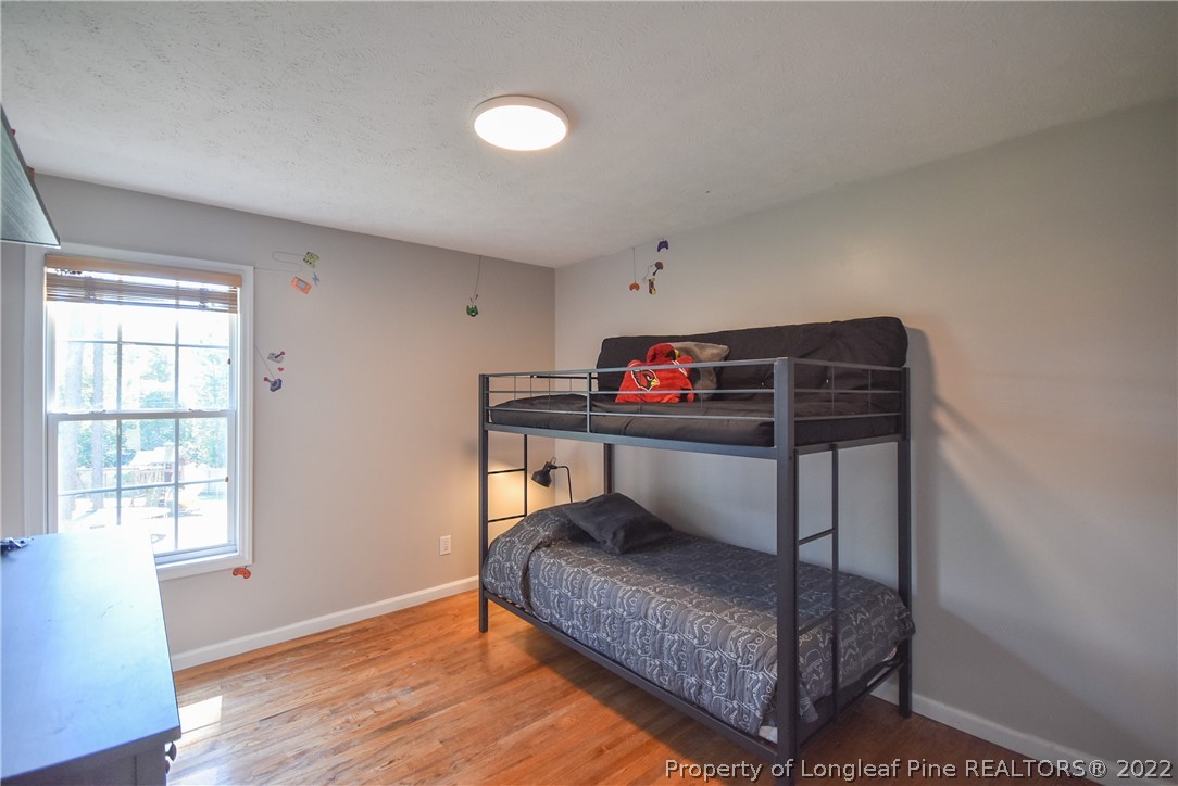 102 Chesapeake Road Cameron, NC 28326 - Photo 20 of 50 a bedroom with furniture and a window