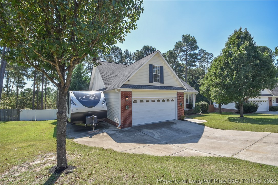 102 Chesapeake Road Cameron, NC 28326 - Photo 2 of 50 a view of a house with a yard and sitting area