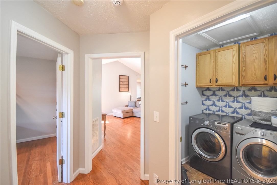 102 Chesapeake Road Cameron, NC 28326 - Photo 22 of 50 a view of a hallway with washer and dryer