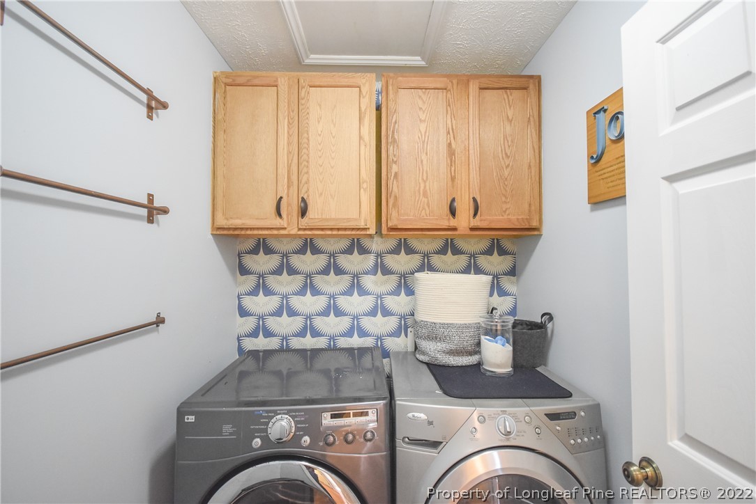 102 Chesapeake Road Cameron, NC 28326 - Photo 23 of 50 a utility room with dryer and washer
