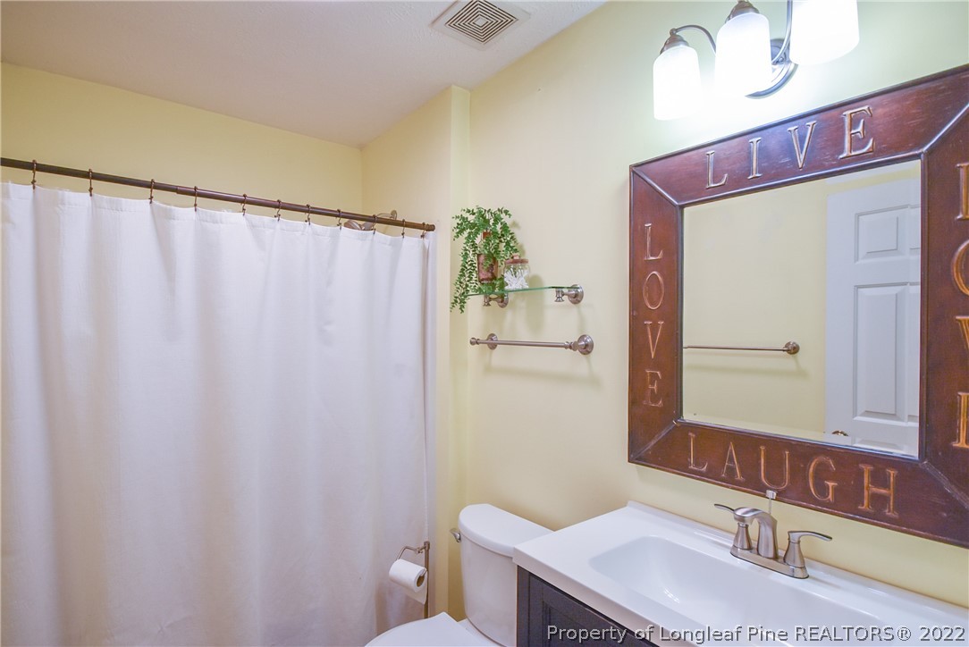 102 Chesapeake Road Cameron, NC 28326 - Photo 25 of 50 a bathroom with a sink a toilet and shower