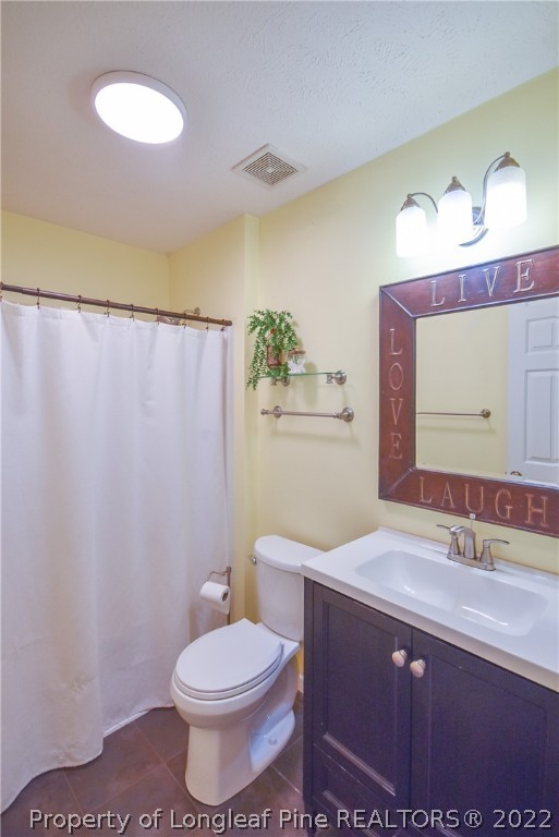 102 Chesapeake Road Cameron, NC 28326 - Photo 26 of 50 a bathroom with a sink a toilet and mirror