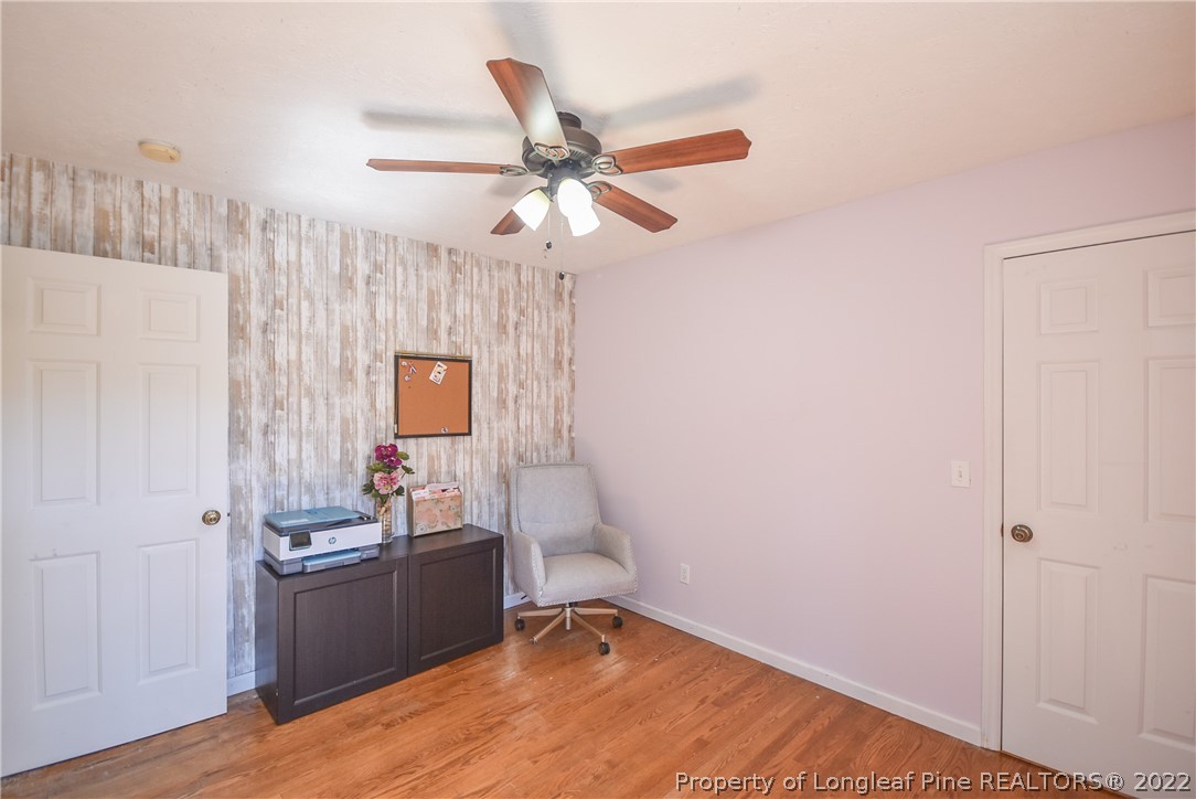 102 Chesapeake Road Cameron, NC 28326 - Photo 28 of 50 a bedroom with a bed and a chandelier