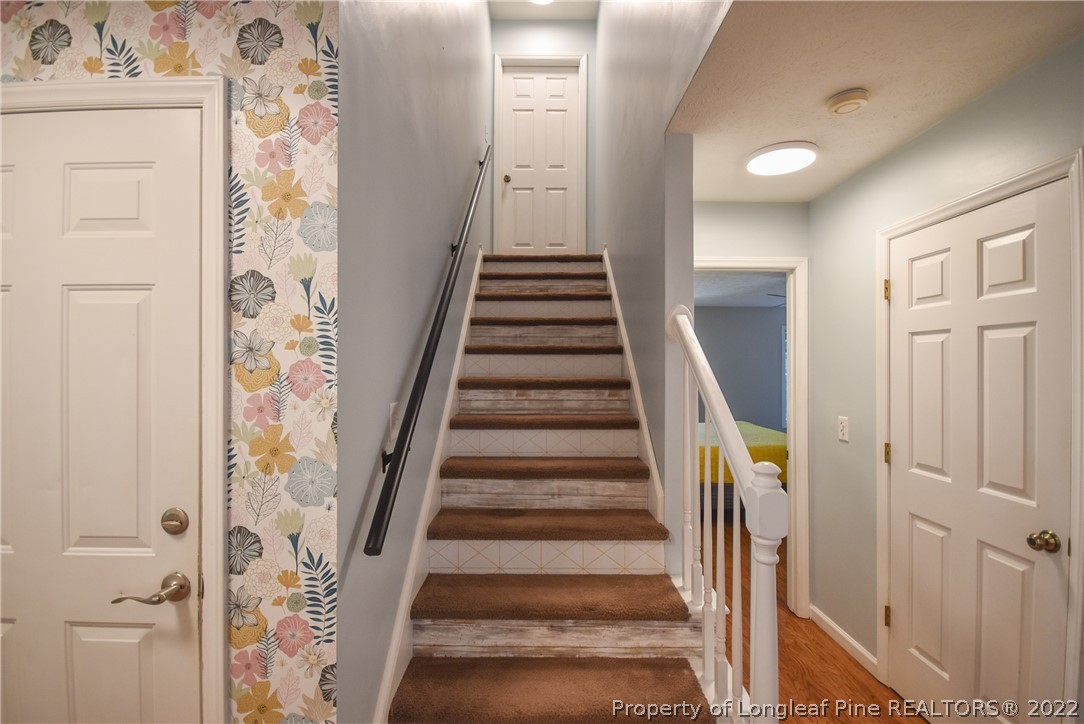 102 Chesapeake Road Cameron, NC 28326 - Photo 29 of 50 a view of a hallway with wooden floor and entryway