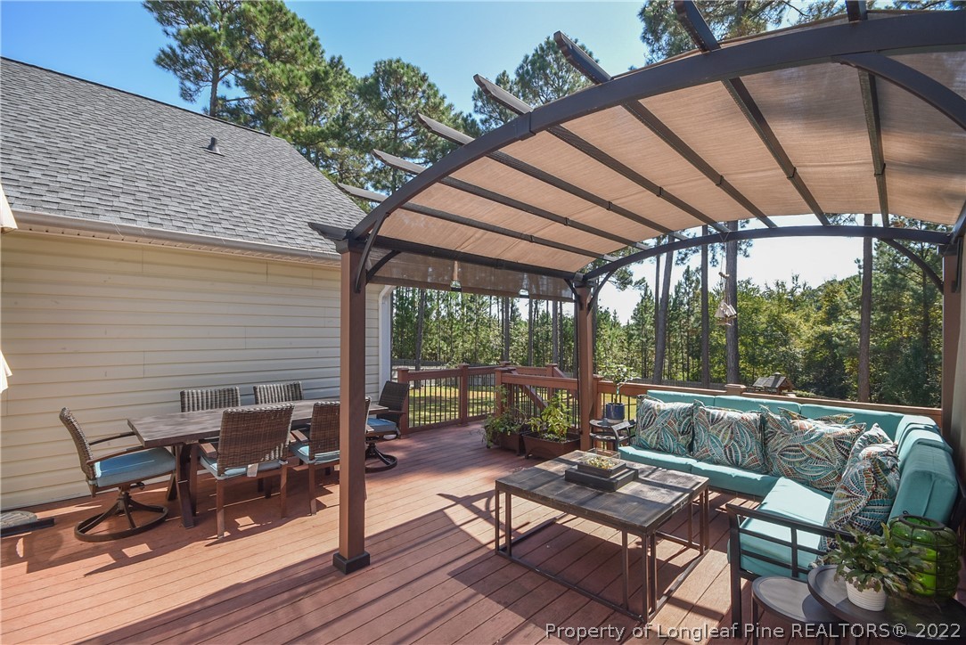 102 Chesapeake Road Cameron, NC 28326 - Photo 40 of 50 a view of sitting area with furniture and wooden deck