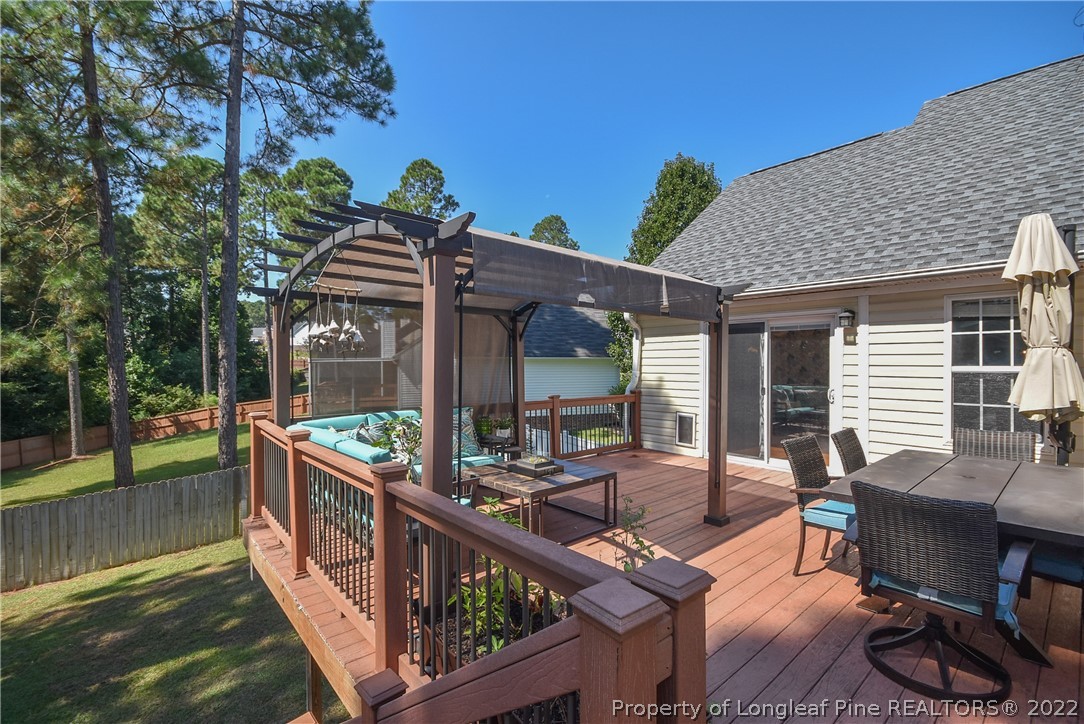 102 Chesapeake Road Cameron, NC 28326 - Photo 42 of 50 a view of a house with backyard porch and sitting area