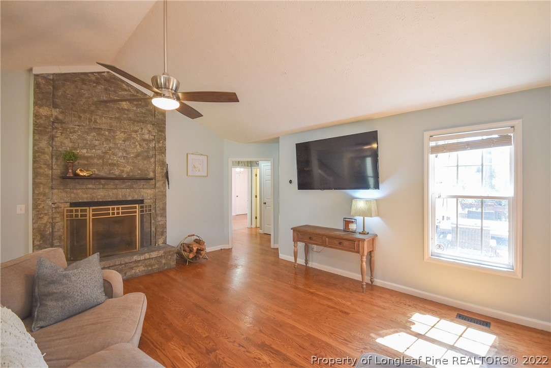 102 Chesapeake Road Cameron, NC 28326 - Photo 6 of 50 a living room with furniture and a fireplace