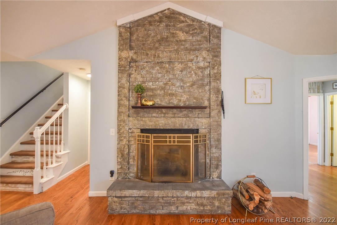 102 Chesapeake Road Cameron, NC 28326 - Photo 9 of 50 a living room with furniture and a fireplace