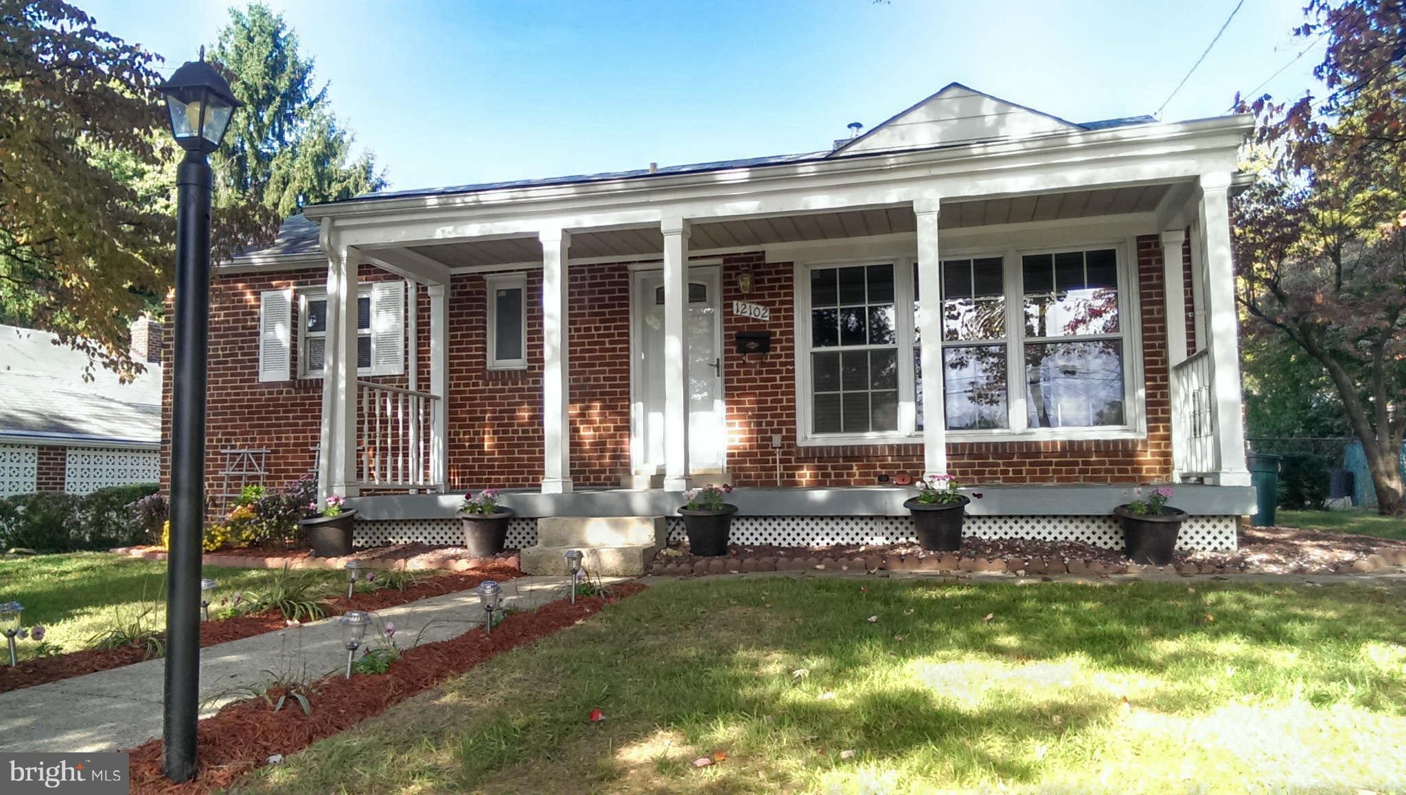 12102 Foley Street Silver Spring, MD 20902 - Photo 1 of 29 a front view of a house with a yard