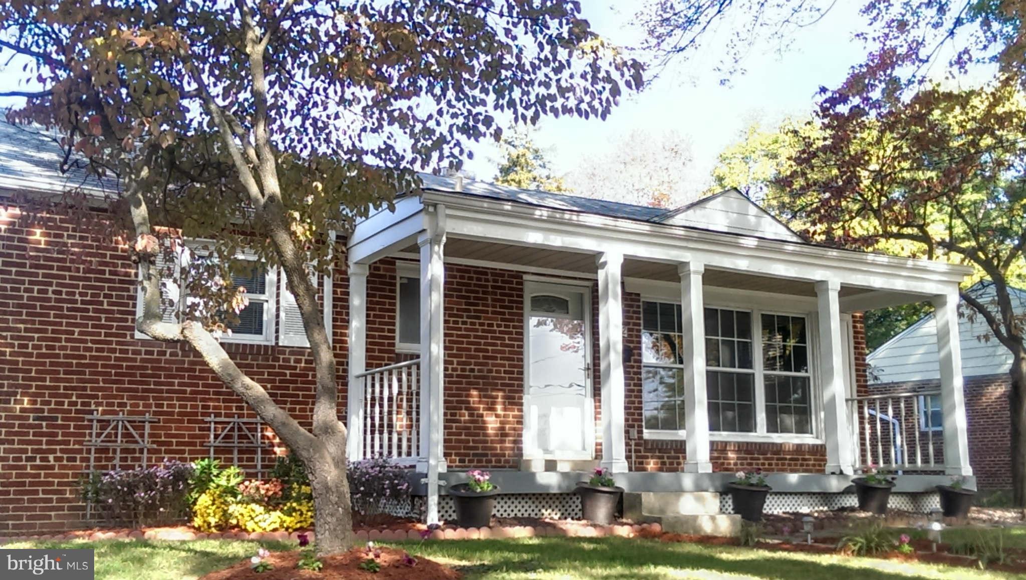 12102 Foley Street Silver Spring, MD 20902 - Photo 2 of 29 front view of house with a yard