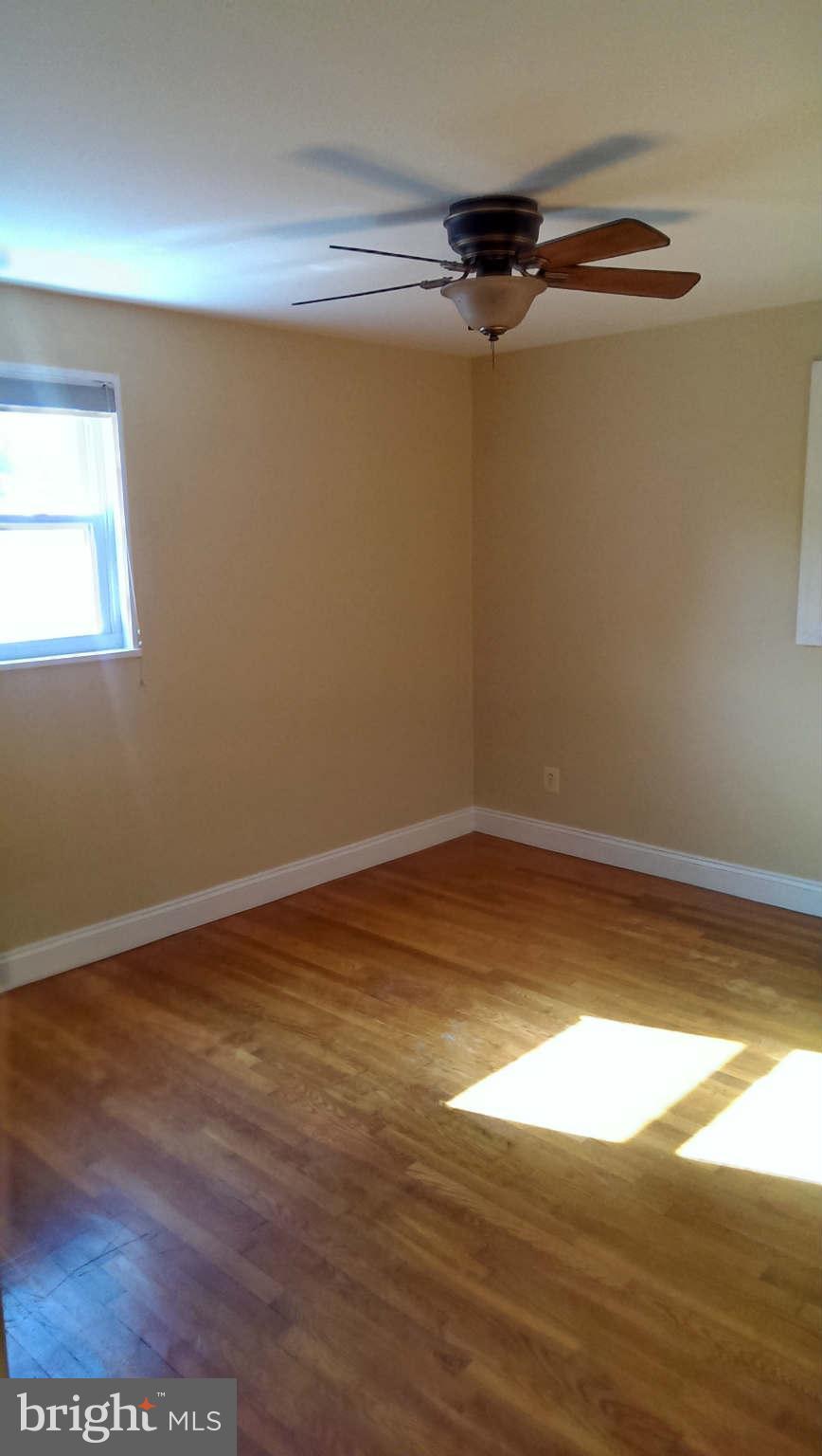 12102 Foley Street Silver Spring, MD 20902 - Photo 14 of 29 a view of a room with wooden floor