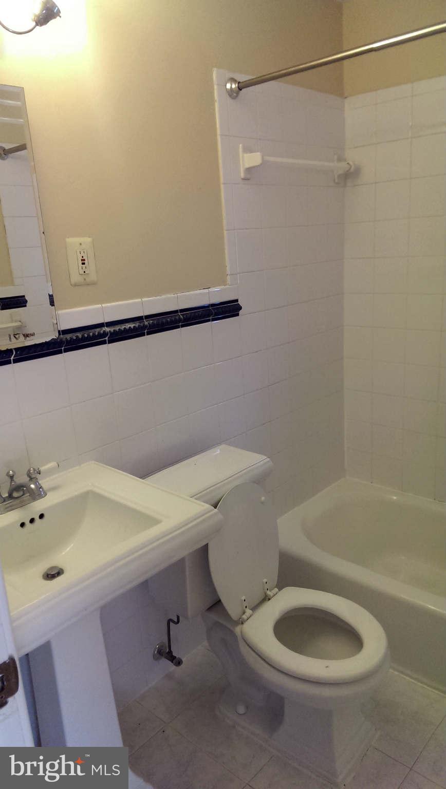12102 Foley Street Silver Spring, MD 20902 - Photo 15 of 29 a bathroom with a sink and toilet