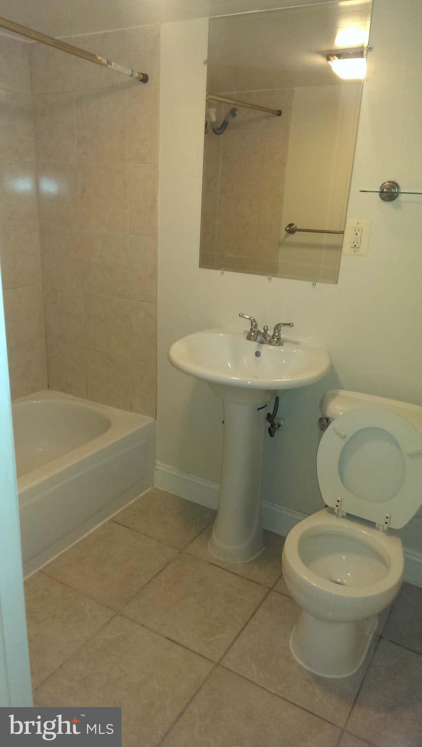 12102 Foley Street Silver Spring, MD 20902 - Photo 21 of 29 a bathroom with a toilet a sink and shower