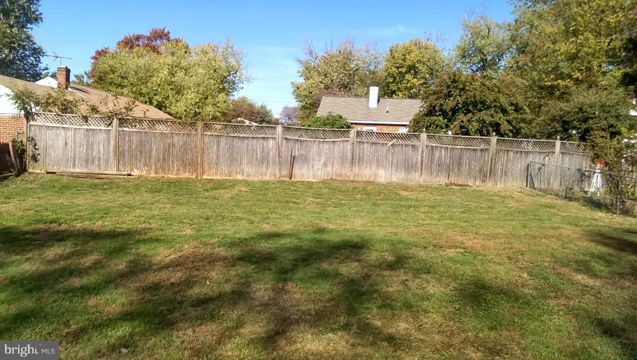 12102 Foley Street Silver Spring, MD 20902 - Photo 29 of 29 a white house with a yard and a small yard