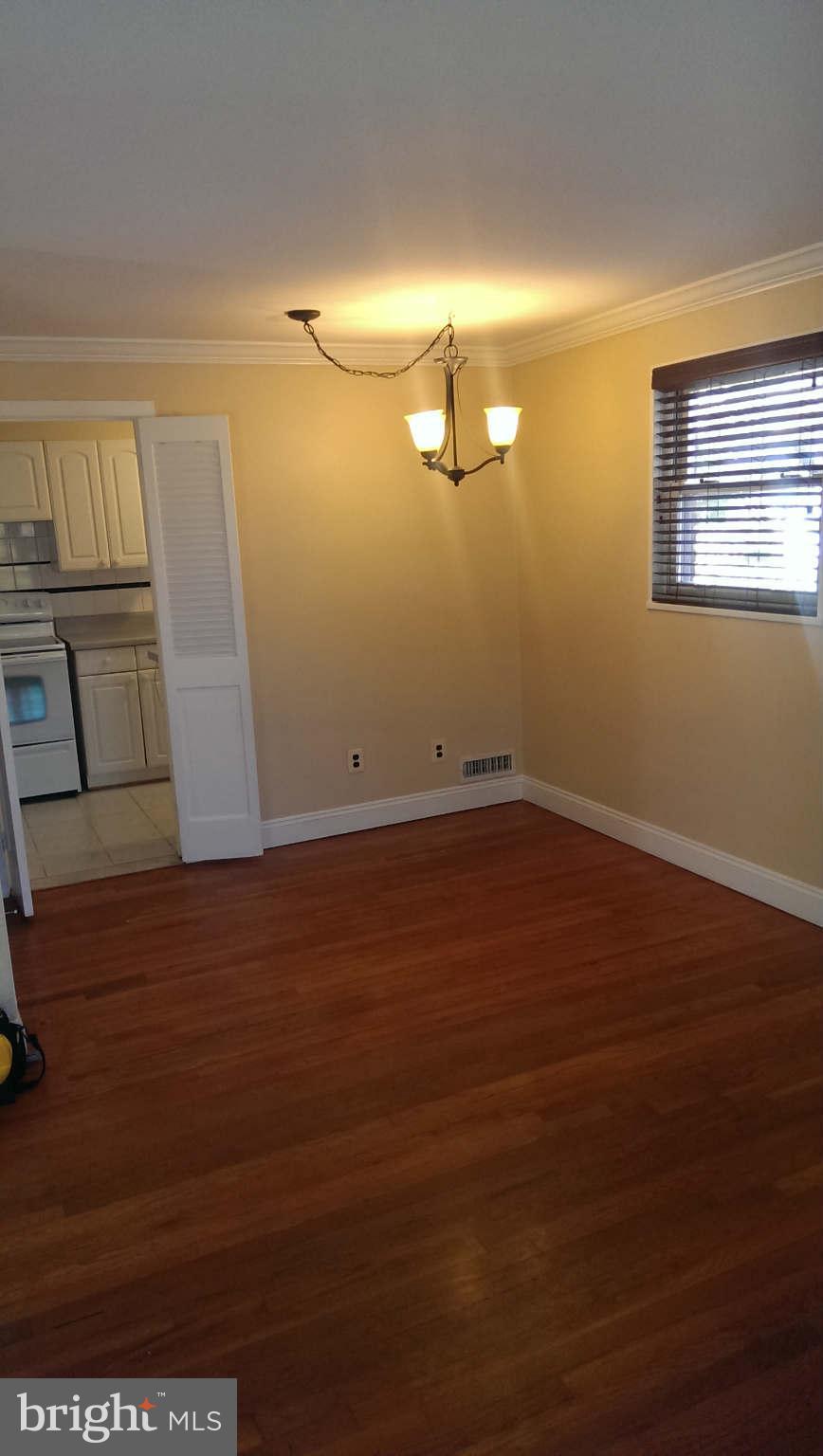 12102 Foley Street Silver Spring, MD 20902 - Photo 7 of 29 a view of room with wooden floor