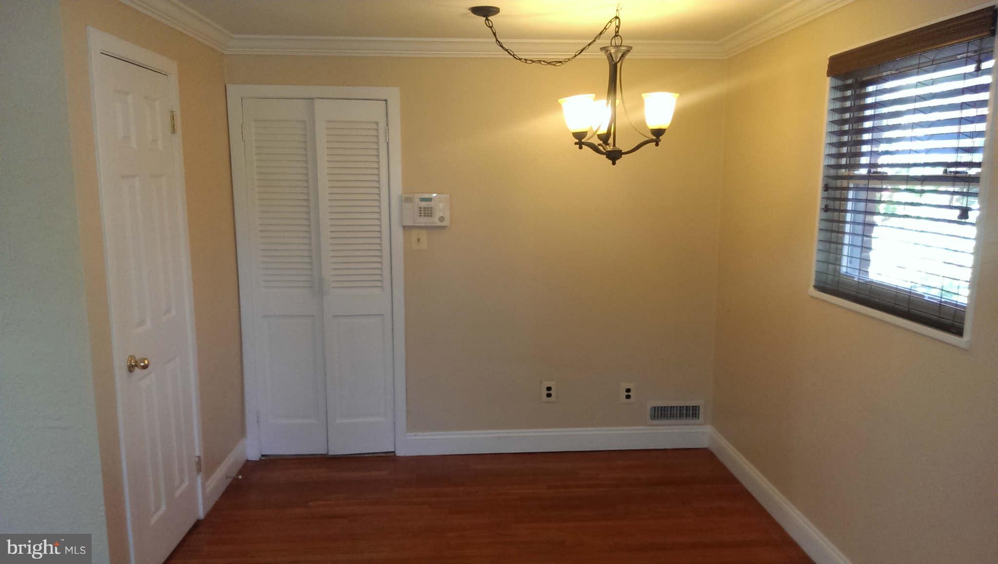 12102 Foley Street Silver Spring, MD 20902 - Photo 8 of 29 a view of a room with wooden floor and windows