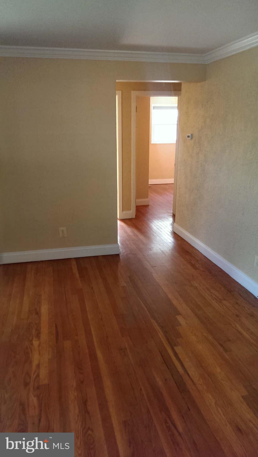 12102 Foley Street Silver Spring, MD 20902 - Photo 9 of 29 a view of a room with wooden floor and a window