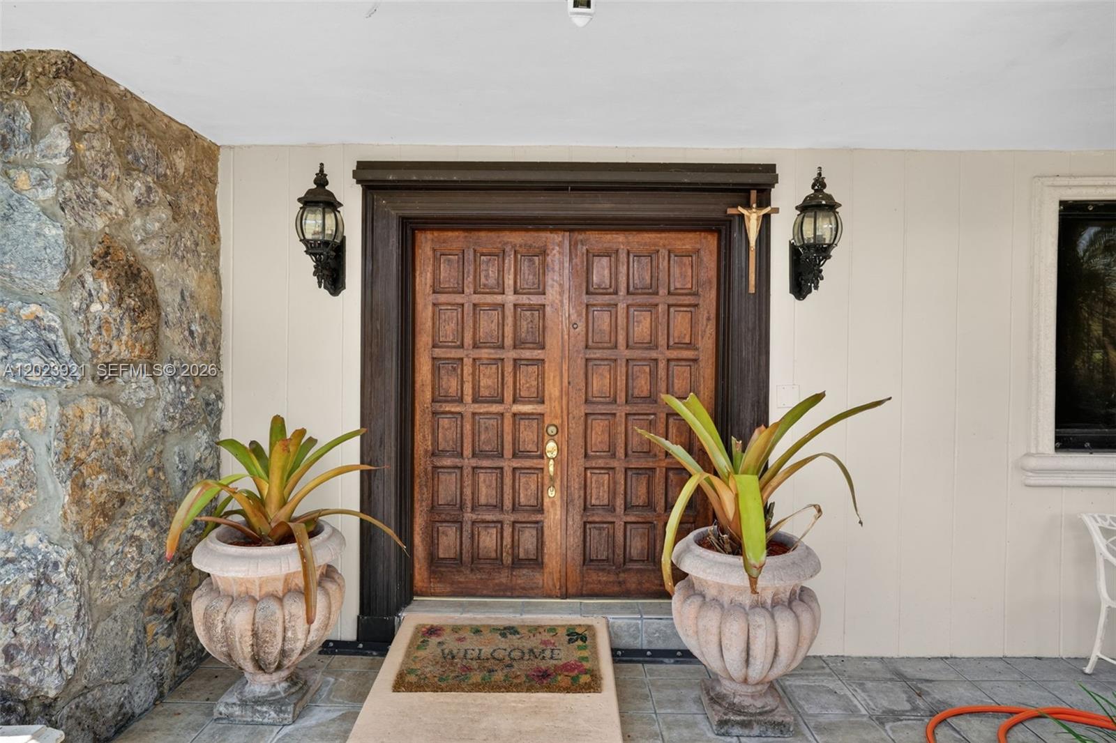 8461 Southwest 68th St Road Miami, FL 33143 - Photo 29 of 65 a living room with furniture and a potted plant