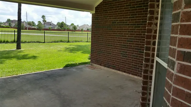 a view of a garden with tall buildings