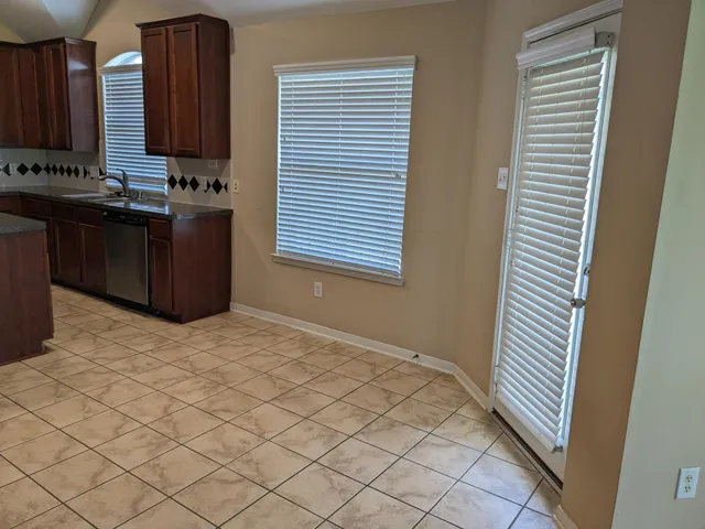 a room with a sink and a mirror