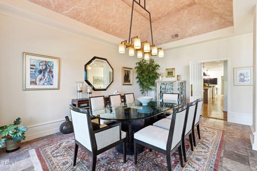 2317 Canyonback Road Los Angeles, CA 90049 - Photo 11 of 72 a view of a dining room with furniture and a chandelier
