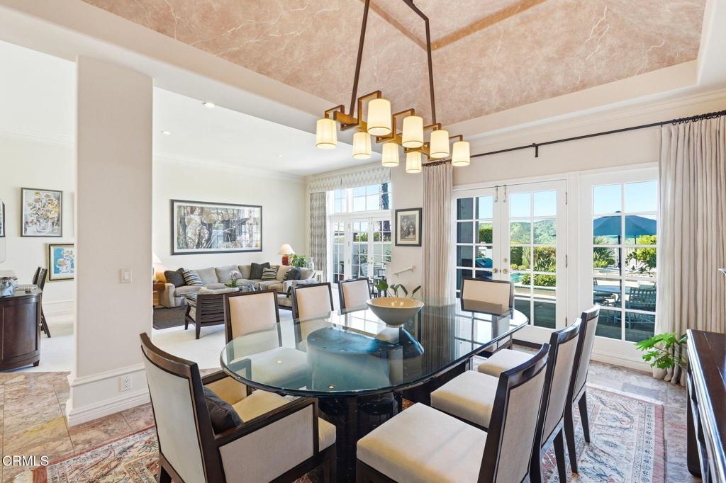 2317 Canyonback Road Los Angeles, CA 90049 - Photo 12 of 72 a view of a dining room with furniture window and wooden floor
