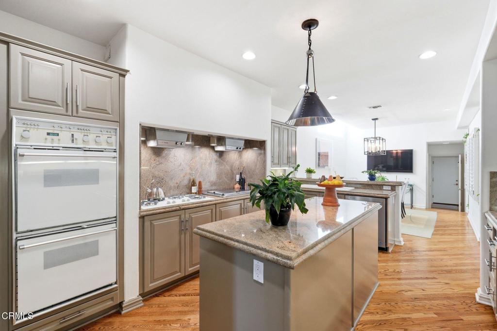 2317 Canyonback Road Los Angeles, CA 90049 - Photo 13 of 72 a kitchen with counter top space and stainless steel appliances