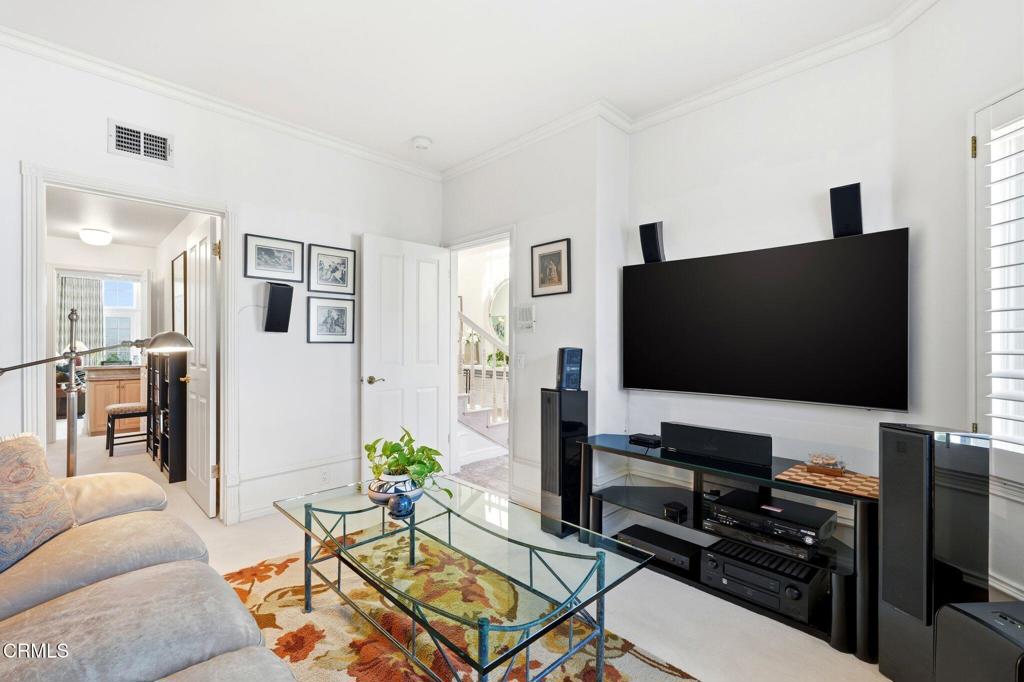 2317 Canyonback Road Los Angeles, CA 90049 - Photo 22 of 72 a living room with furniture and a flat screen tv