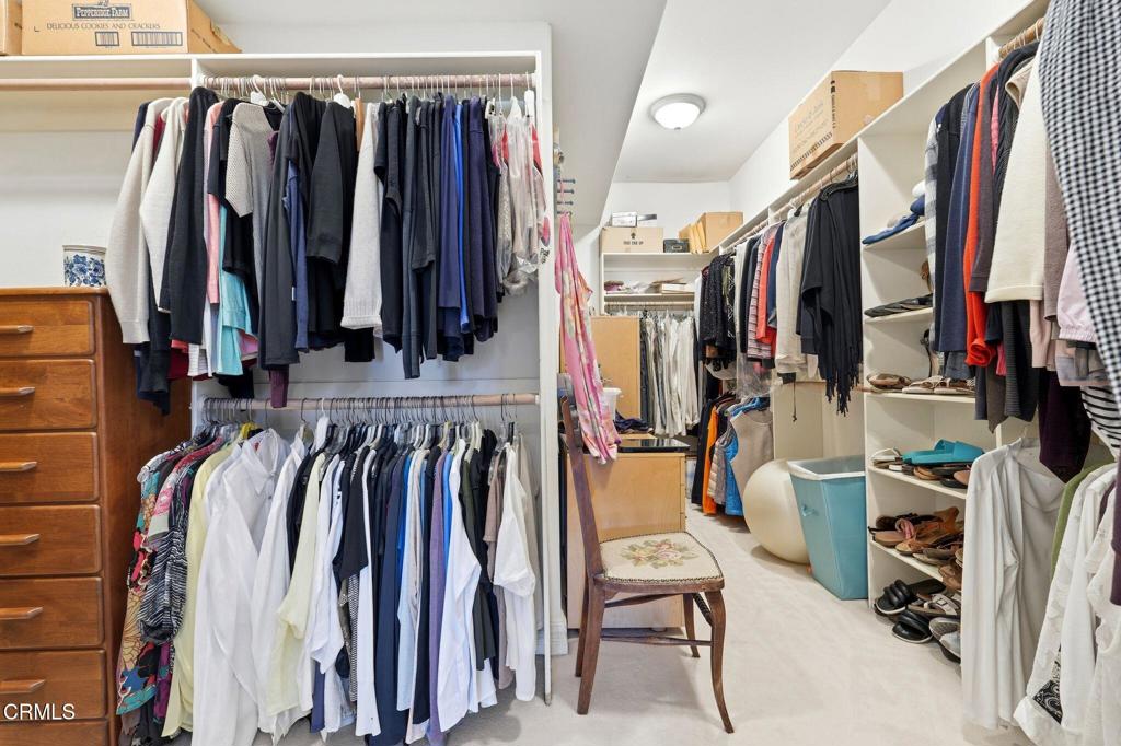 2317 Canyonback Road Los Angeles, CA 90049 - Photo 36 of 72 a view of walk in closet with clothes and shoes