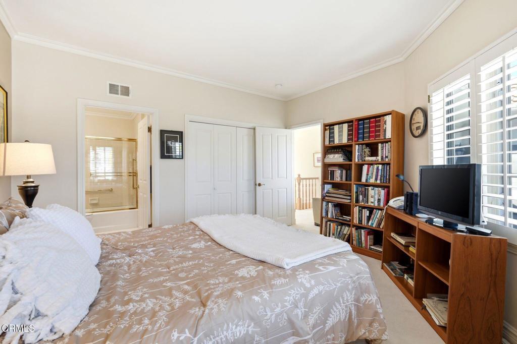 2317 Canyonback Road Los Angeles, CA 90049 - Photo 43 of 72 a bedroom with a bed and a flat screen tv