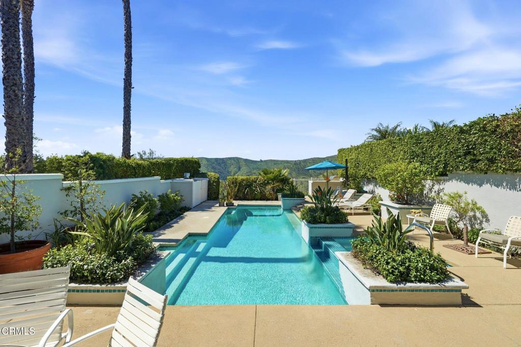 2317 Canyonback Road Los Angeles, CA 90049 - Photo 50 of 72 a view of a swimming pool with a patio