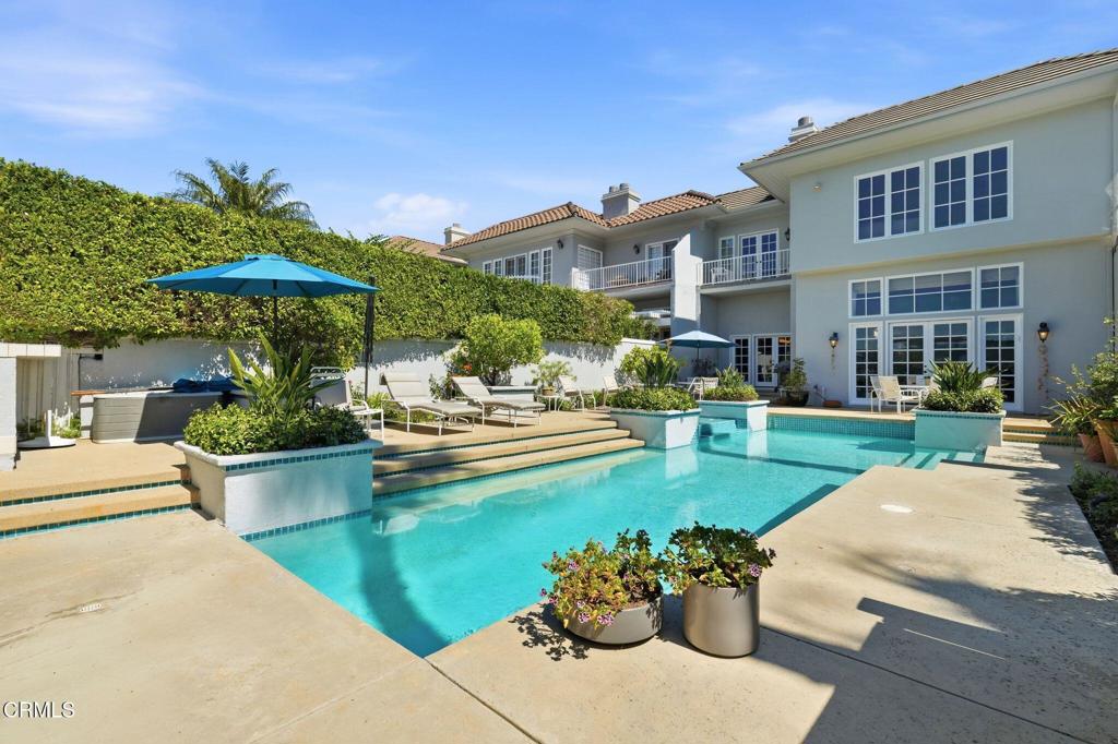 2317 Canyonback Road Los Angeles, CA 90049 - Photo 54 of 72 a view of a house with swimming pool and sitting area