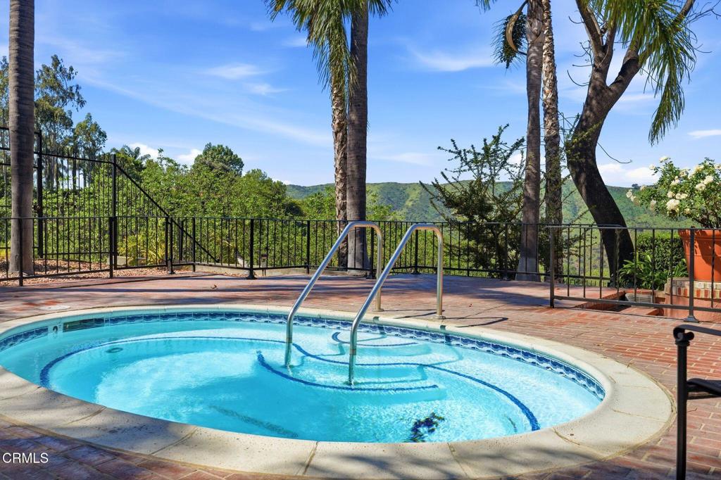 2317 Canyonback Road Los Angeles, CA 90049 - Photo 60 of 72 a view of a swimming pool with a patio