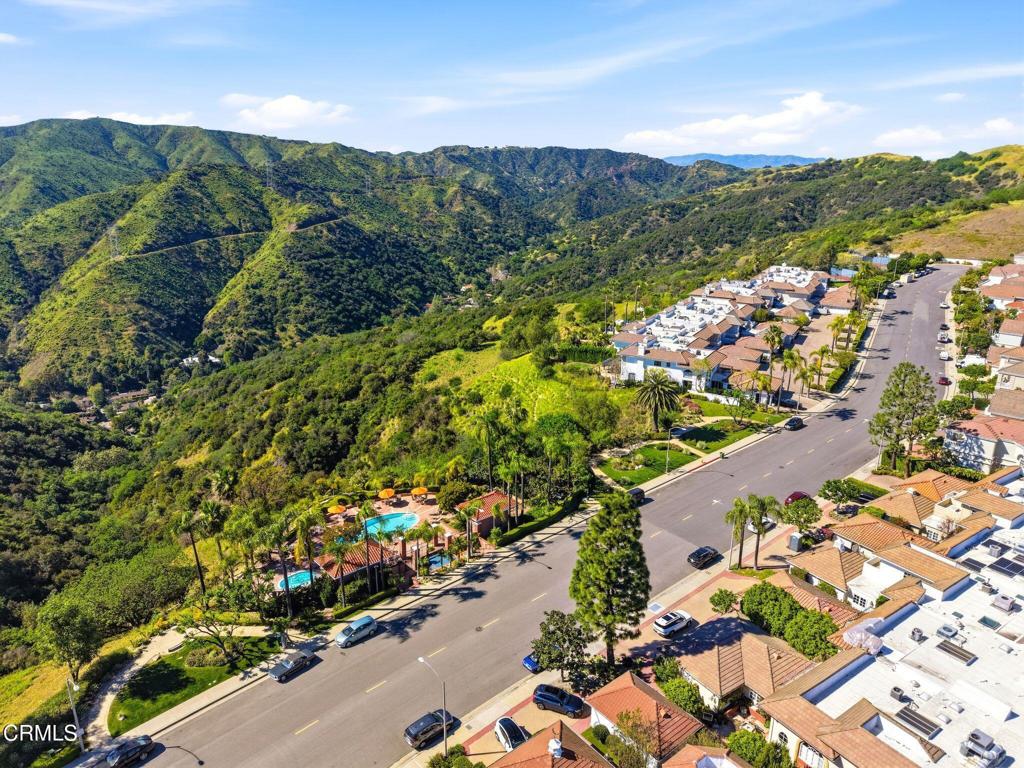 2317 Canyonback Road Los Angeles, CA 90049 - Photo 67 of 72 a view of a city with mountains in the background