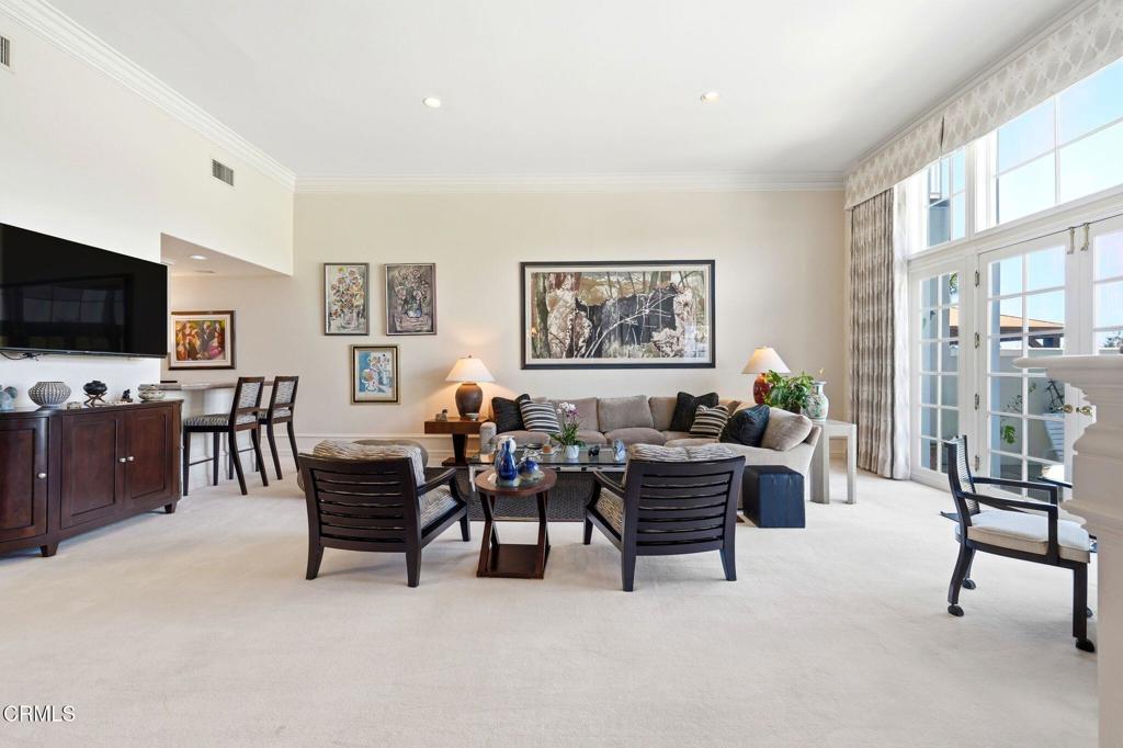 2317 Canyonback Road Los Angeles, CA 90049 - Photo 7 of 72 a living room with furniture and a flat screen tv