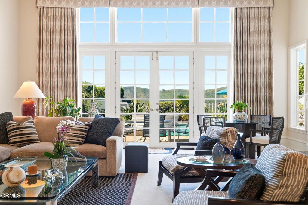 2317 Canyonback Road Los Angeles, CA 90049 - Photo 9 of 72 a living room with furniture and a large window