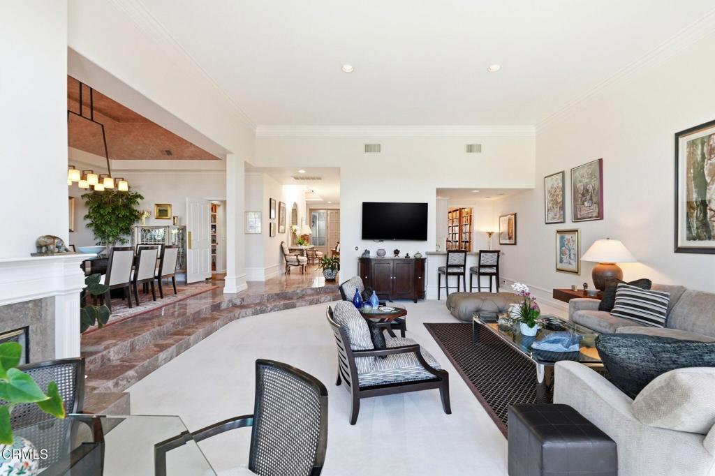 2317 Canyonback Road Los Angeles, CA 90049 - Photo 10 of 72 a living room with furniture and a flat screen tv
