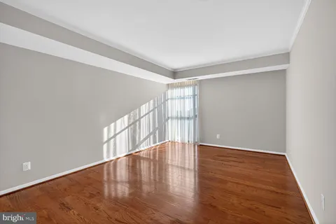 a bedroom with furniture and a flat screen tv
